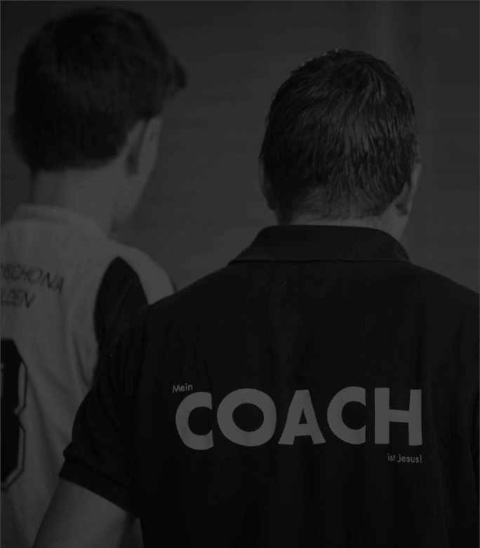 A coach mentoring a player